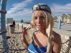 A blonde is on the beach, having sex in public with a horny dude