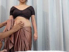 Hot Tamil aunty in a saree gets down with her big natural tits and curvy rear end