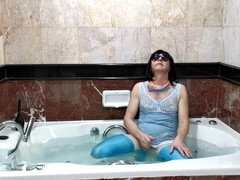 Crossdresser showcases lingerie and enjoys a sissy shower in pantyhose