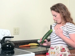 Ana Molly masturbates with vegetables in kitchen