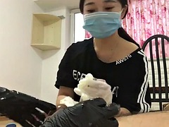 Chinese femdom in latex gloves