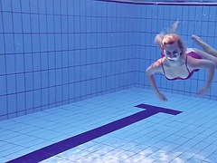 Proklova takes off her bikini and dives under the water