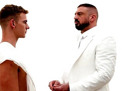 A man in a suit is banging the hell out of a petite lad