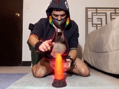 Guy with the dragon-themed pleasure stick ready for action