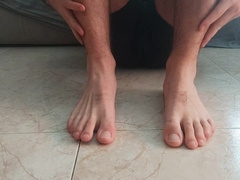 Nasty fellow rubbing his soles. Sole fetish