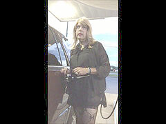 Gassing up in mini-dress