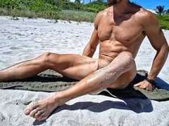 Athletic guy Andrearmani shows off his smooth bubble butt while doing nude yoga at a Rio beach