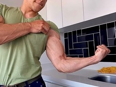 Muscular man shows off bulging veins and flexes for an admirer