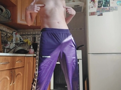 A Russian dude in sweatpants wanks off in the kitchen.