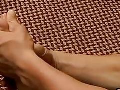 Jock massages his feet and toes before jerking off solo