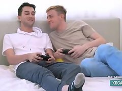 Two cute twink boy step brothers have sex during video game