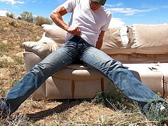 Wetting and pissing jeans on a couch in the desert