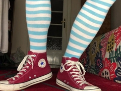 Femboy dressed in Chat, hip high socks and demonstrating nude soles