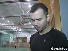 Buff guy sucking in gym