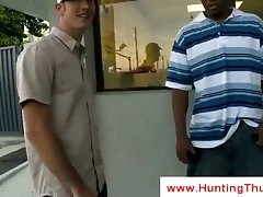 White gay boy eats chocolate at a shop