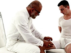 Suited DILF is playing with the girthy cock of a teen