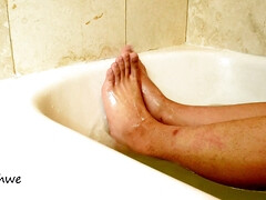 Feet in hot water in a jacuzzi