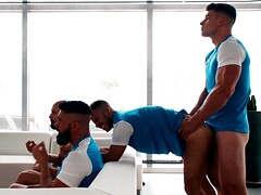 Sporty dudes getting off while watching the game