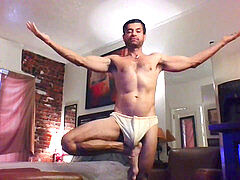 Gay hunk flaunting his massive package in bulging speedo