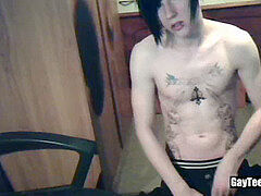 Tattood twunk plays with his big uncircumcised cock