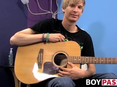 Young man plays guitar before dick stroking and cumming