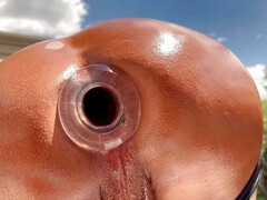 Huge hallow buttplug in outdoors