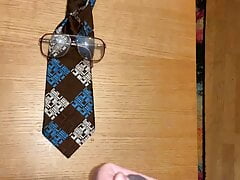 Cum on ugly glasses and ugly tie.