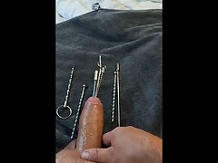 Extreme urethral sounding + cum. Hard oiled cock stuffed full. Multiple objects and sounds in cock.