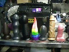 chubby mechanic trying out nine butt plugs