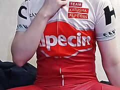 Cute guy in cycling suit jerks off and cums