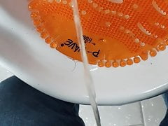 Public urinal piss