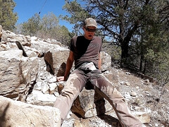 Wetting jeans while rock collecting outdoor