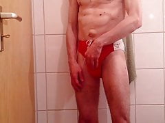 guy in red speedo and show his cock