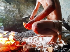 Neanderthal stud faps his man meat in a colon near a fire