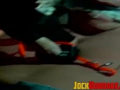 Muscle jock tied up with fat rope during outdoor BDSM