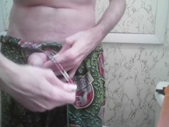 Lean lad Jt Sweet ties up his cock and balls while cranking one out in the shower