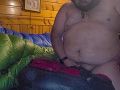 Chubby guy in a hood crushes a bag with a satisfying climax.