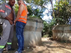 Employees plumbing bare behind the construction website