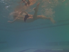 Taut booty finds faux-cock underwater and swims with it