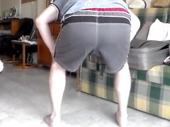 John is peeing all into his shorts