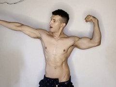 In the casino, someone pays me to flex my muscles and stroke my big uncut cock