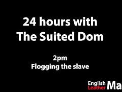 Suited Dom flogs slave with two whips PREVIEW