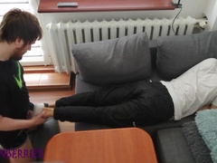 Young fellow pays out his bills with his soles