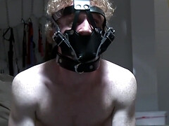 Submisssive man with long hair acts as a pet for his master