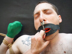 German woman and a submissive man making a BDSM tape