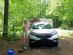Sissy Denver Shoemaker giving his car a wash in a Thong Bikini