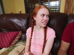 A redhead with pigtails is making one dude really happy