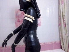 Dominant nun in latex outfit gives a seductive handjob