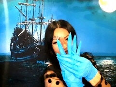 Dominatrix Nika with a glove fetish puts on medical gloves and destroys them with her long tools