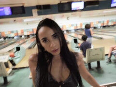 Brunette girl Gaby Ortega blows a horny guy at bowling alley